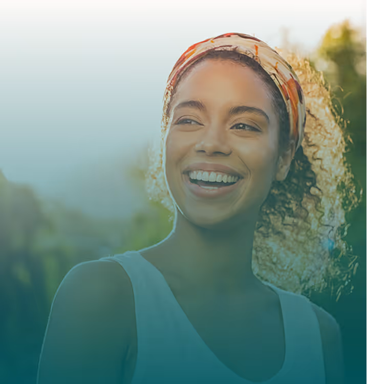 Young woman smiling outdoors