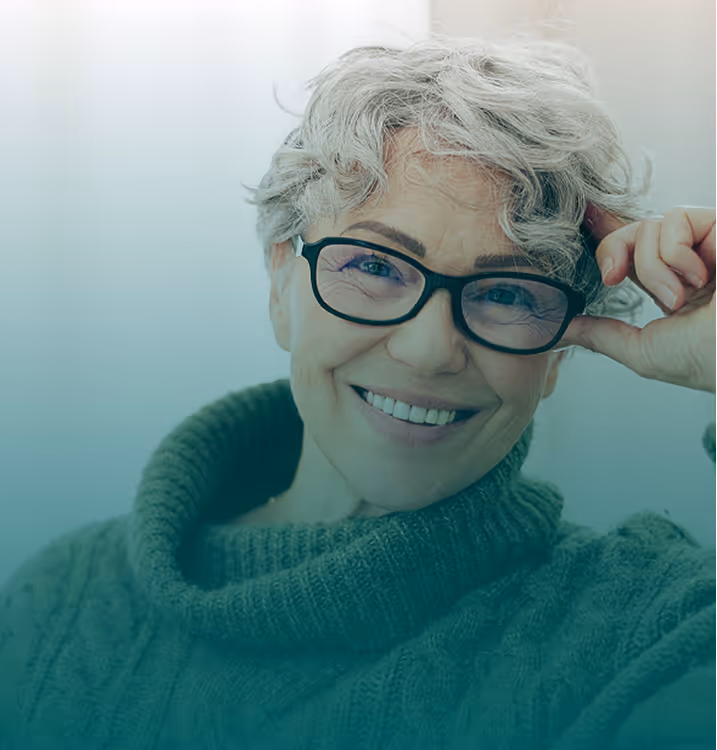 Woman with grey hair and glasses