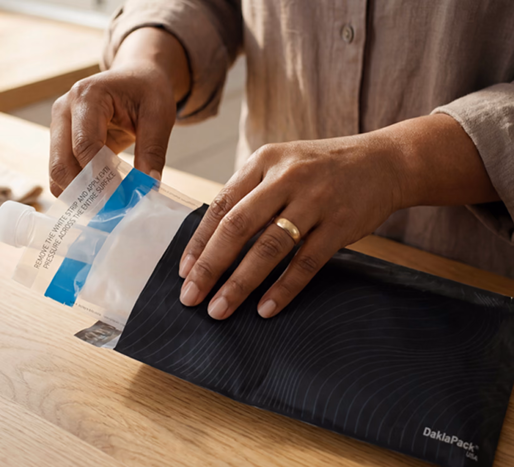 Sliding the sample into its mailing pouch